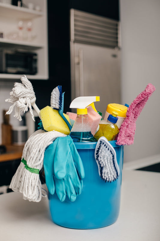 cleaning products in blue bucket 
