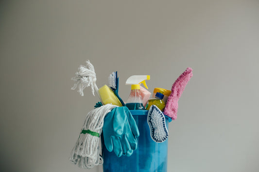 blue bucket with cleaning supplies inside 